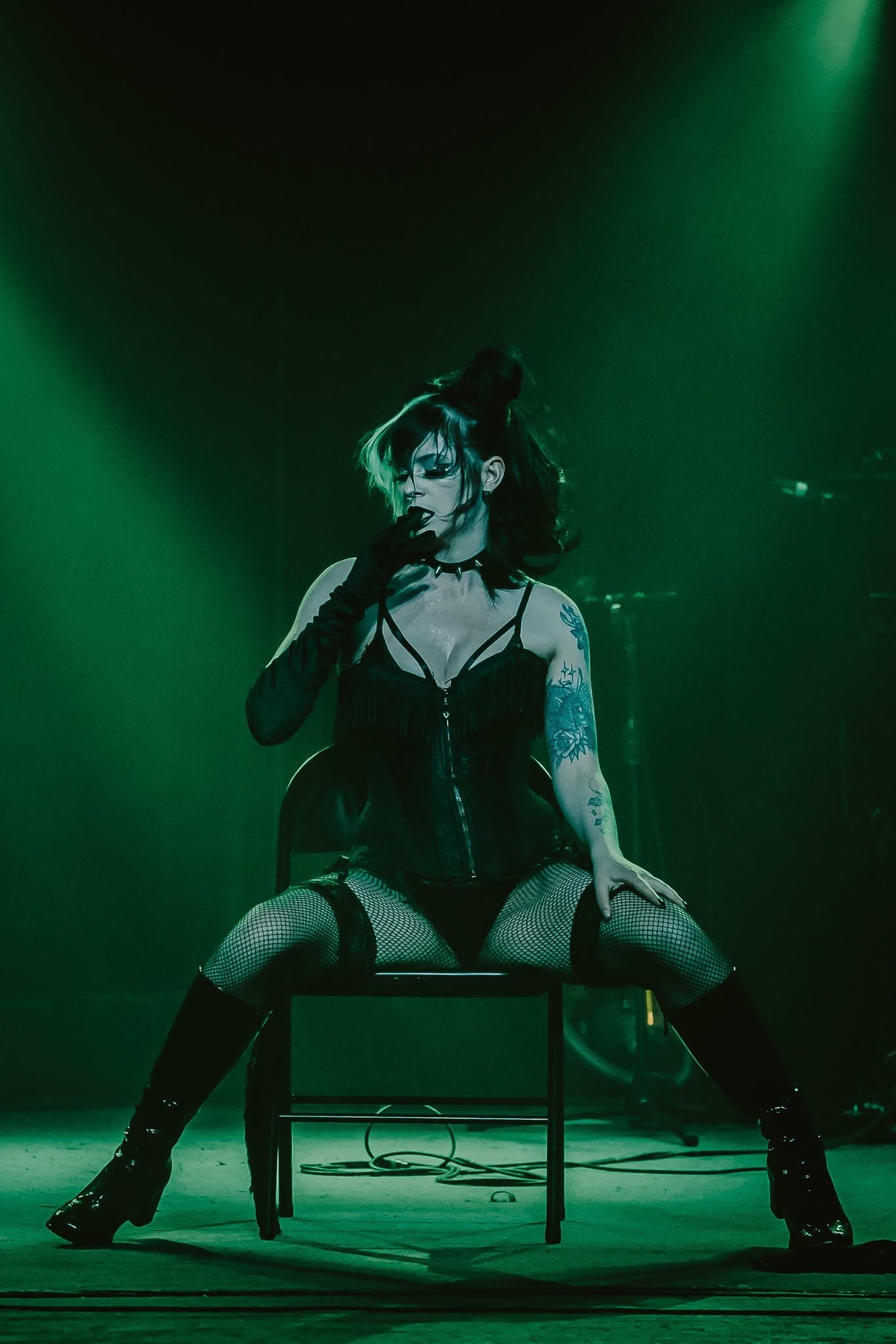 Performer under green light
